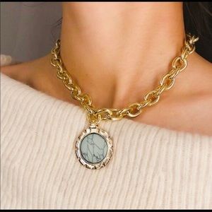 Gold necklace with turquoise piece